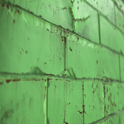 Old damaged painted brick wall