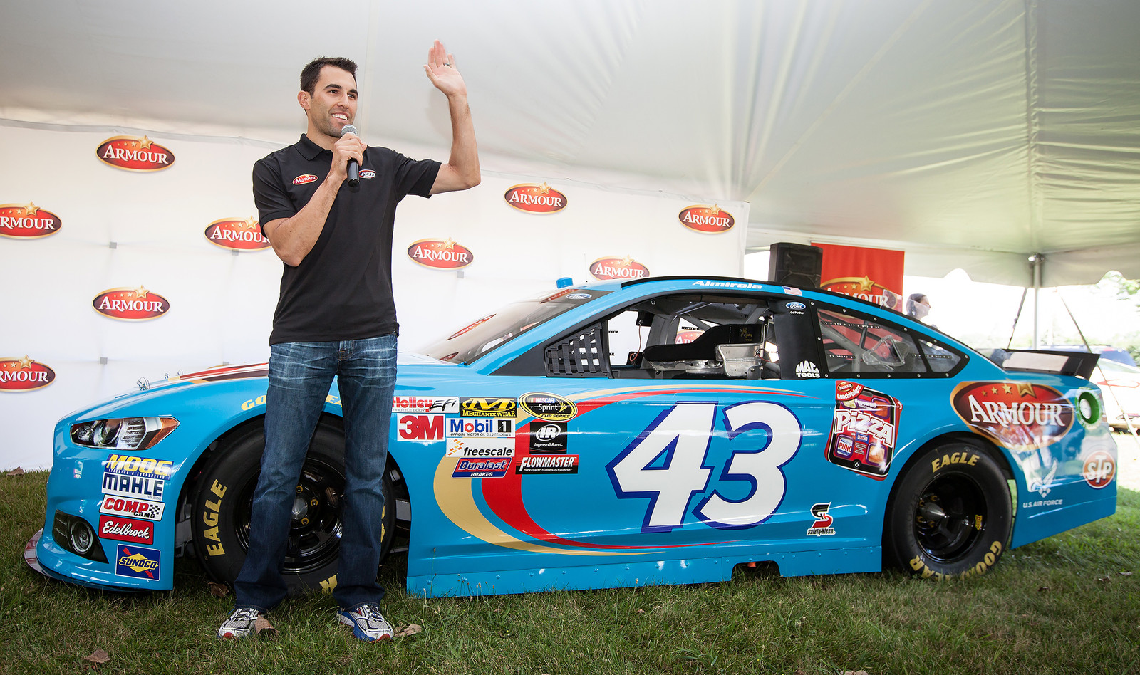 Aric Almirola posing with the #43 Armour Meats Ford Fusion during an appearance event at Holmes Elementary School on August 12th, 2015.
(Photo credit: Brad Schloss Photographic, Smithfield Foods)