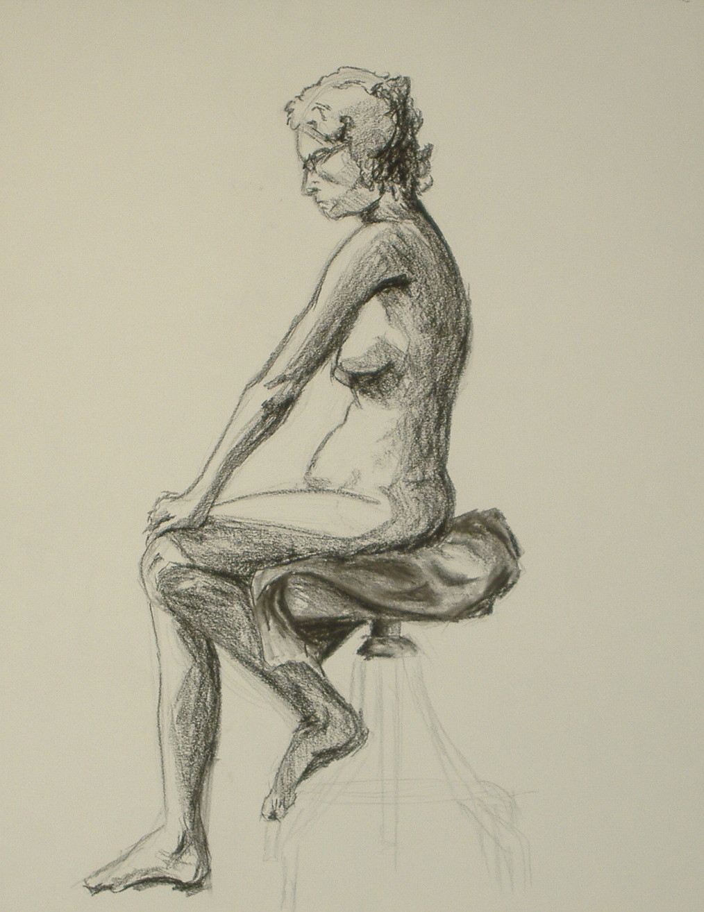 Female sitting on a chair.