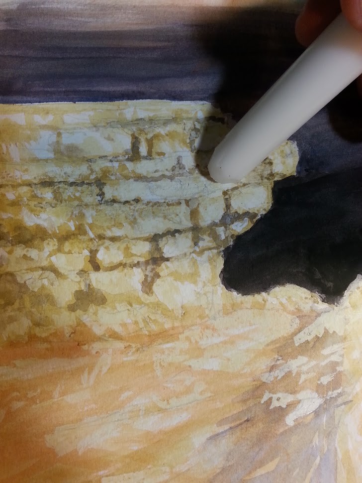 Here, I'm rubbing a candle for the wax on the rocks, I'm doing this to create areas that I want to be protected from the paint. The wax provides me with a rough surface and texture.