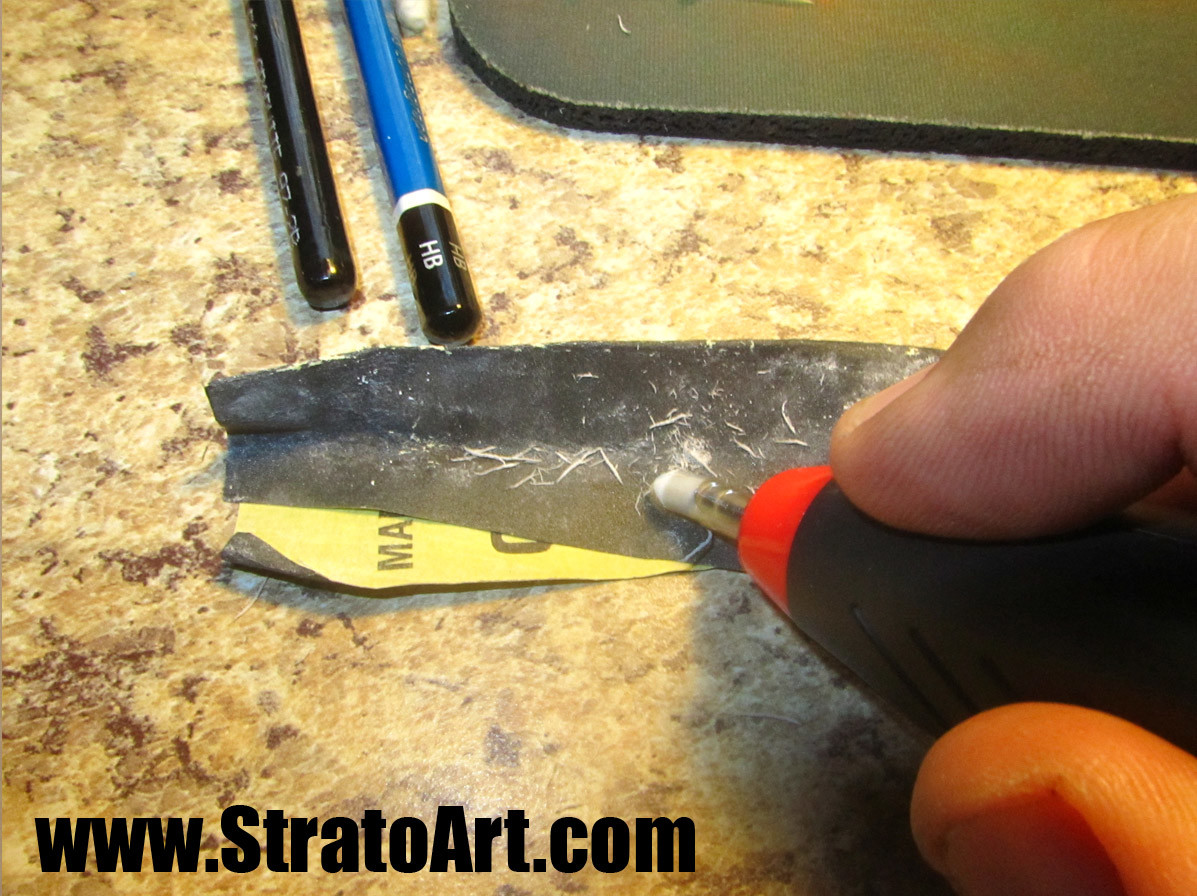 Here, I'm sharpening the eraser nib in my electric  eraser. I use an electric eraser to pull out the white highlights I need in the drawing