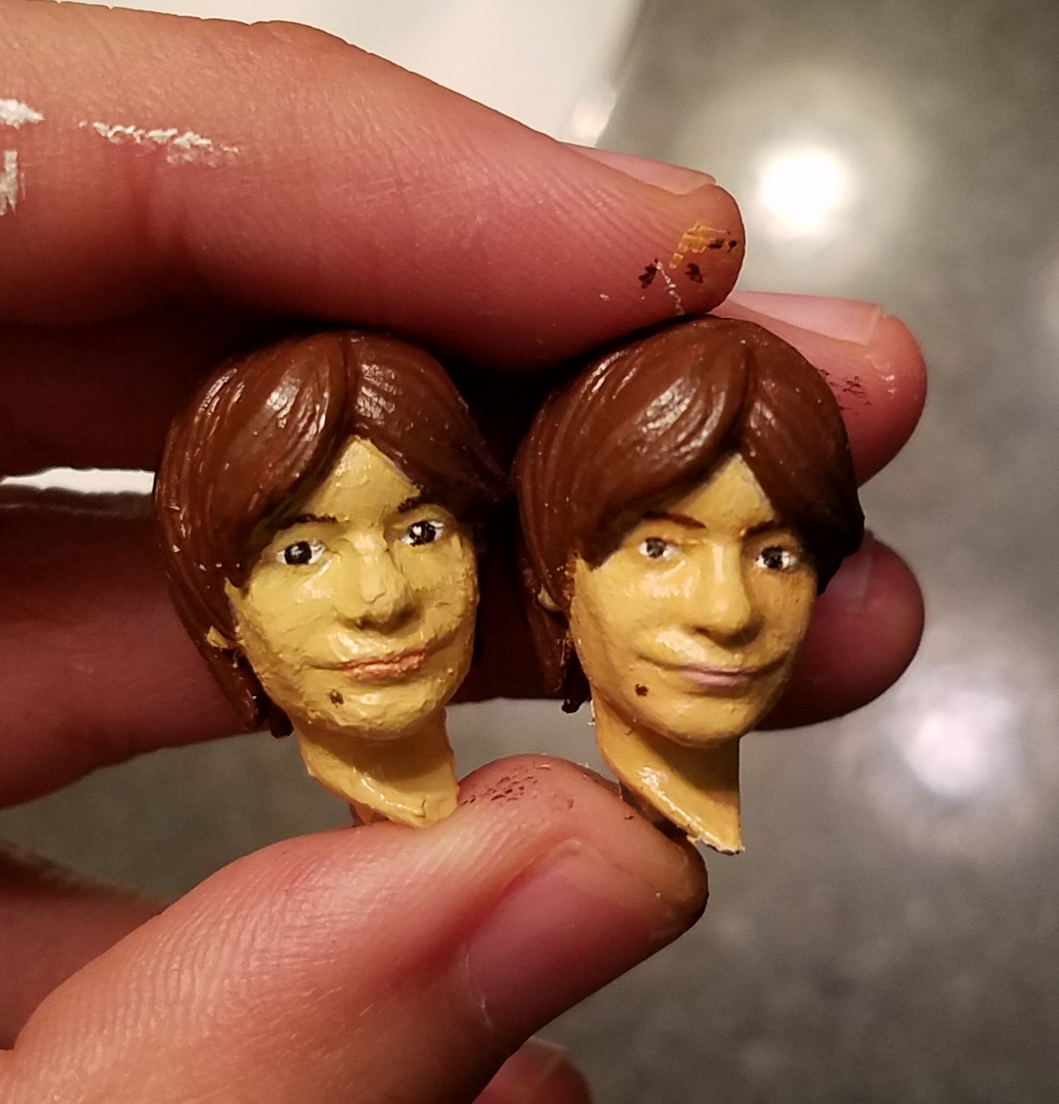For Example this is the first and second head. Tried to paint the second one with thinner paints. I'm not much of a painter so shoutout to my girlfriend for helping me with this! The eyes were super tiny and were terrifying to paint...