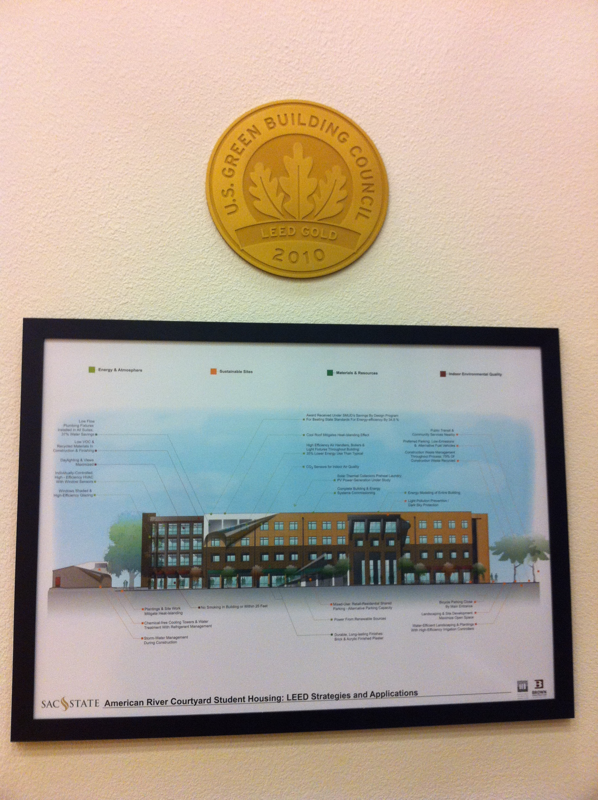 Old work - LEED interpretive plaque for a student housing project I helped design (2 years into that building design between myself and five other team members) - along with the LEED medallion!