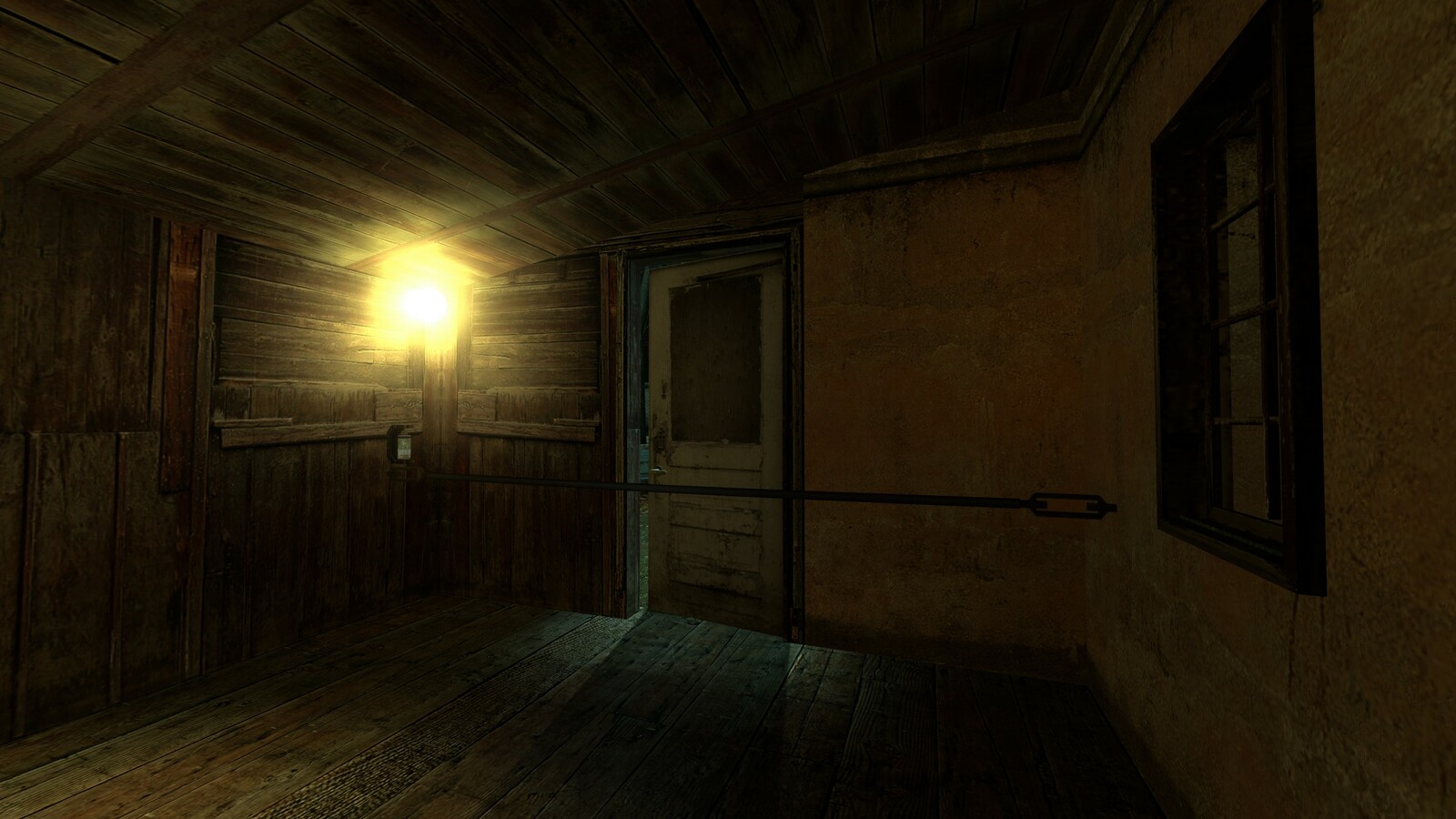 Door left ajar so that the player is afforded the opportunity to spot the grenade trap on the other side.