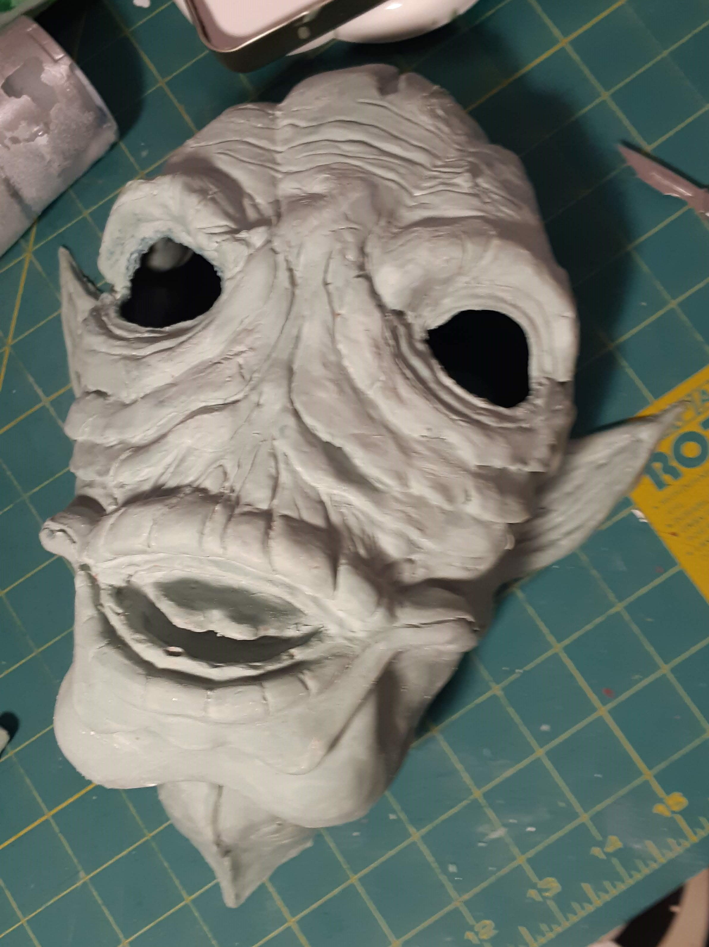 Latex mask with eyes cut out