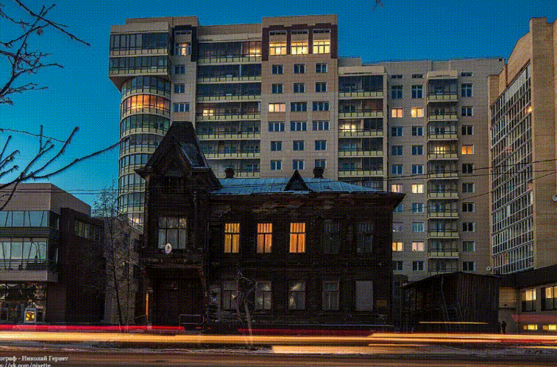 Parallax gif: an old house among concrete jungle