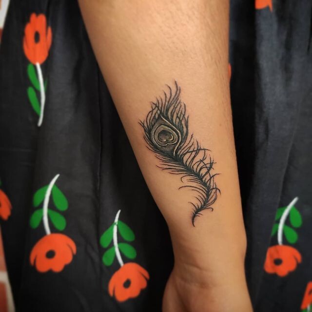 Peacock feather Tattoo with flute small design made on wrist  YouTube