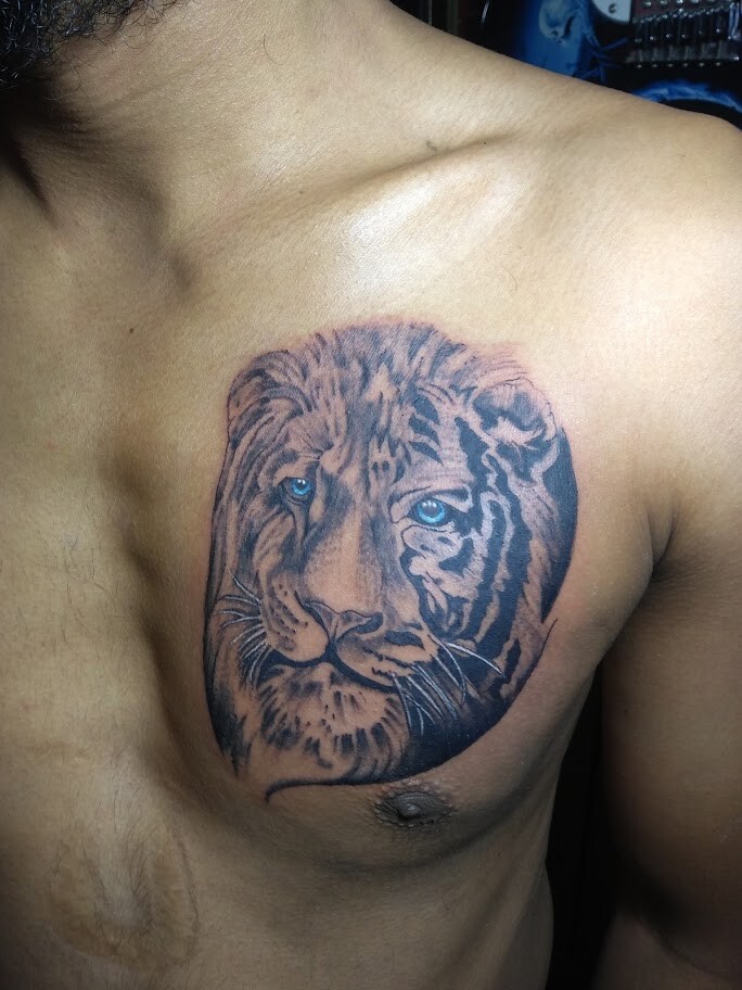 Pavan Kumar - Lion and Tiger face Tattoo