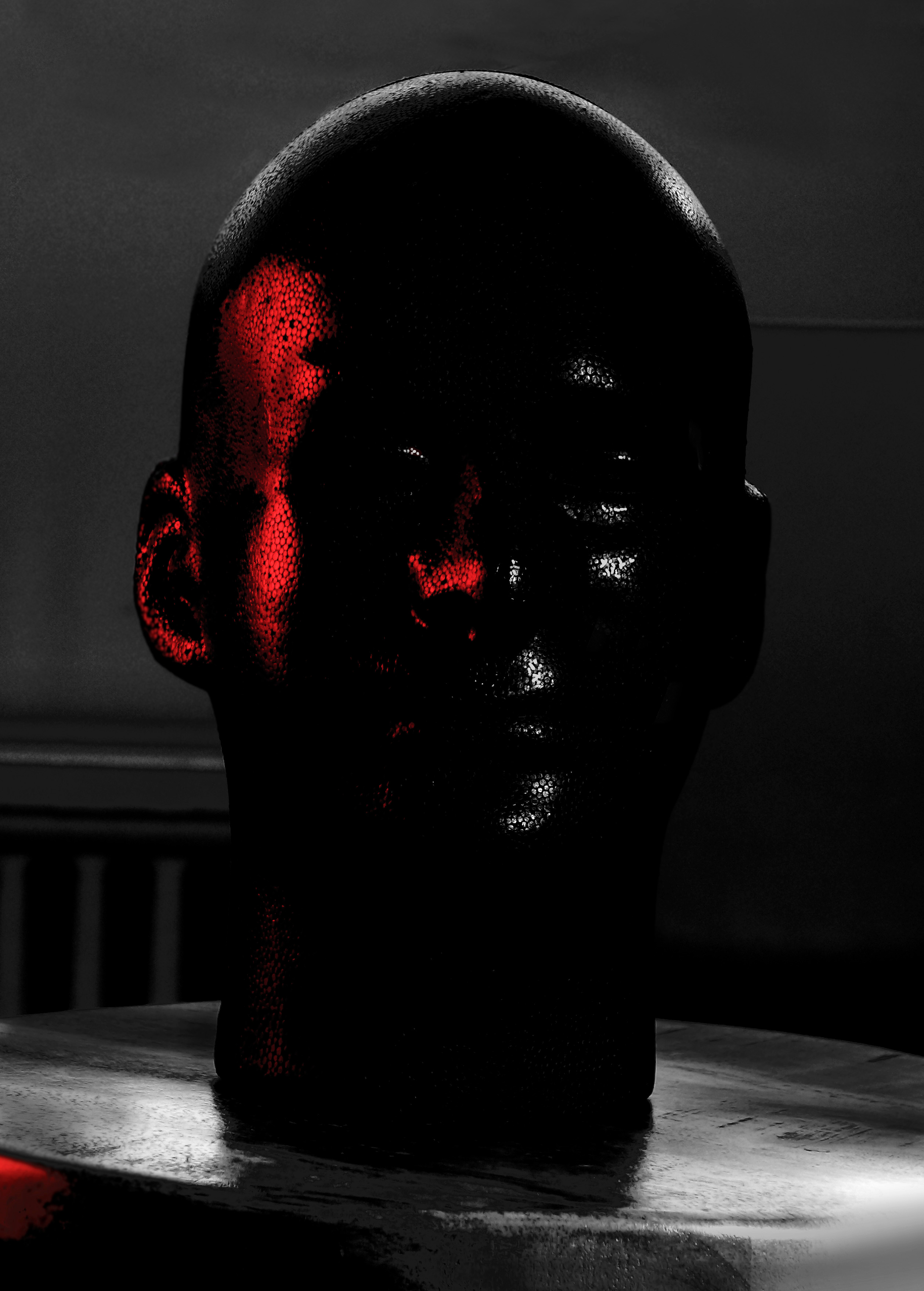 Photograph of a the manikin head demonstrating the  placement and properties of  of the highlight and the reflected light. Created by Vince Mancuso