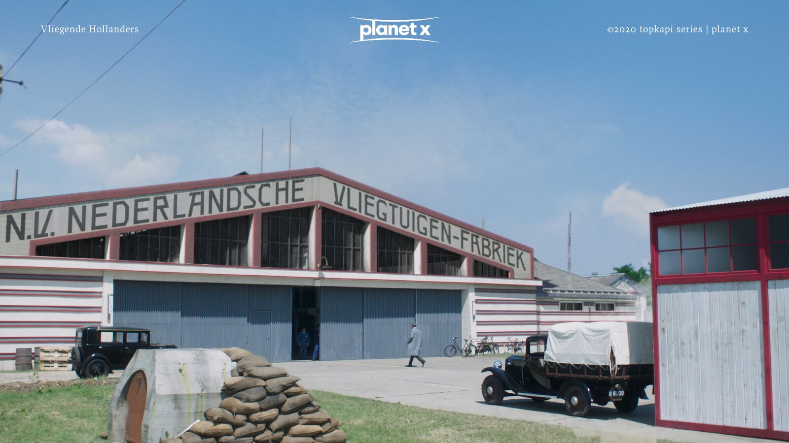 this is a scene of the Elta years later after Fokker uses the hangars as factory halls to build his planes and as you can see from the bunker entrance near the front the war is closing in in europe. most likely it is 1939 here.