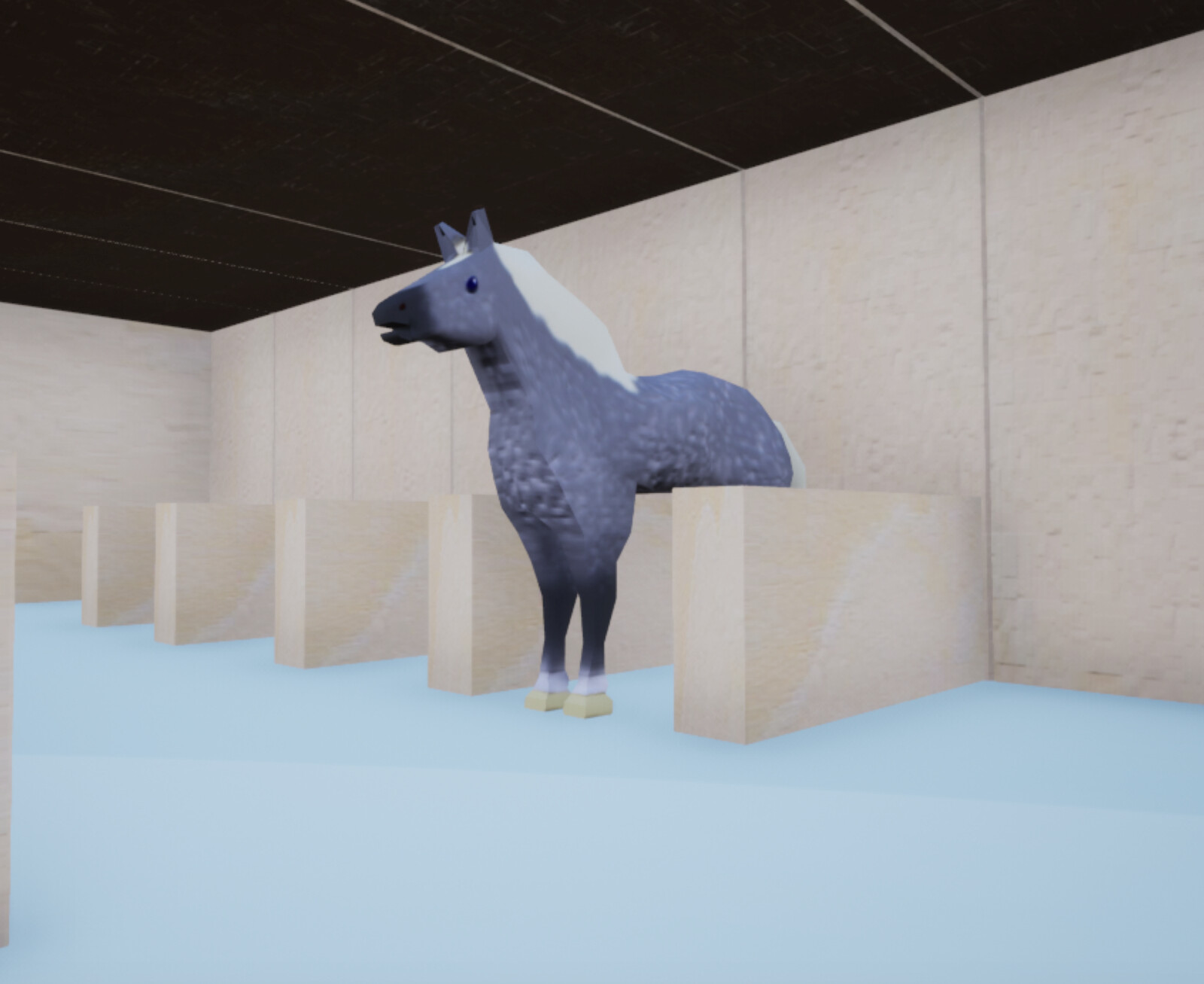 Low-angle view of one of the toy horses in the toy block stable