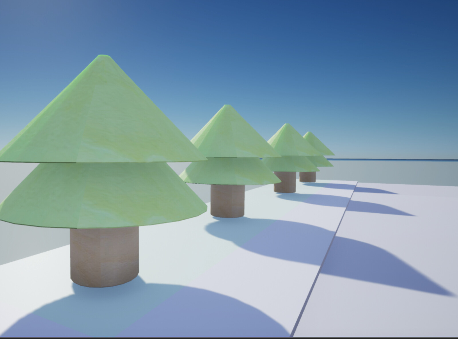 Close-up of some toy block trees next to the toy block stable 