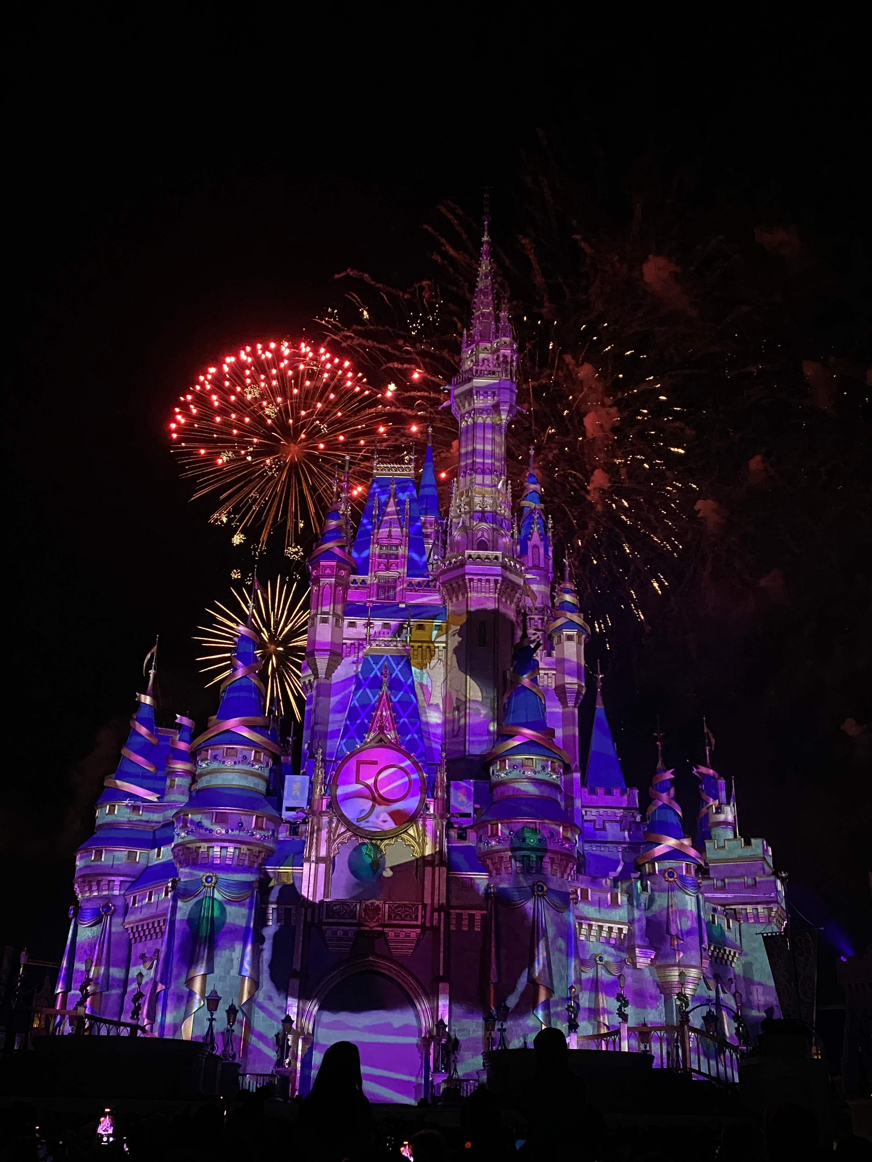 Swirls envelop the castle as the step sisters rip Cinderella's clothes. Bits of the necklace Cinderella wears break out of the windows and fall down towards the audience.