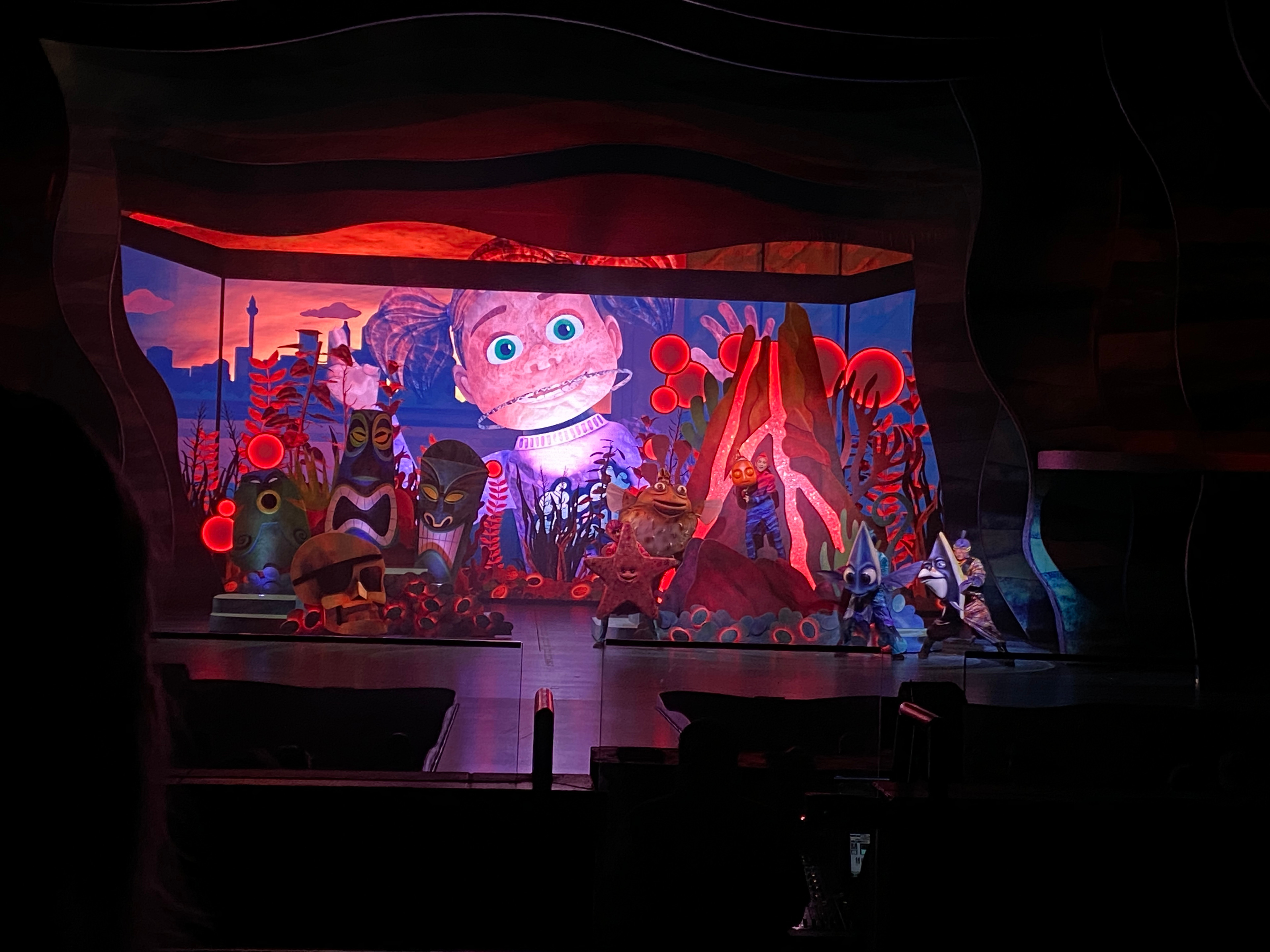 As Darla enters, the lights change to red for added drama