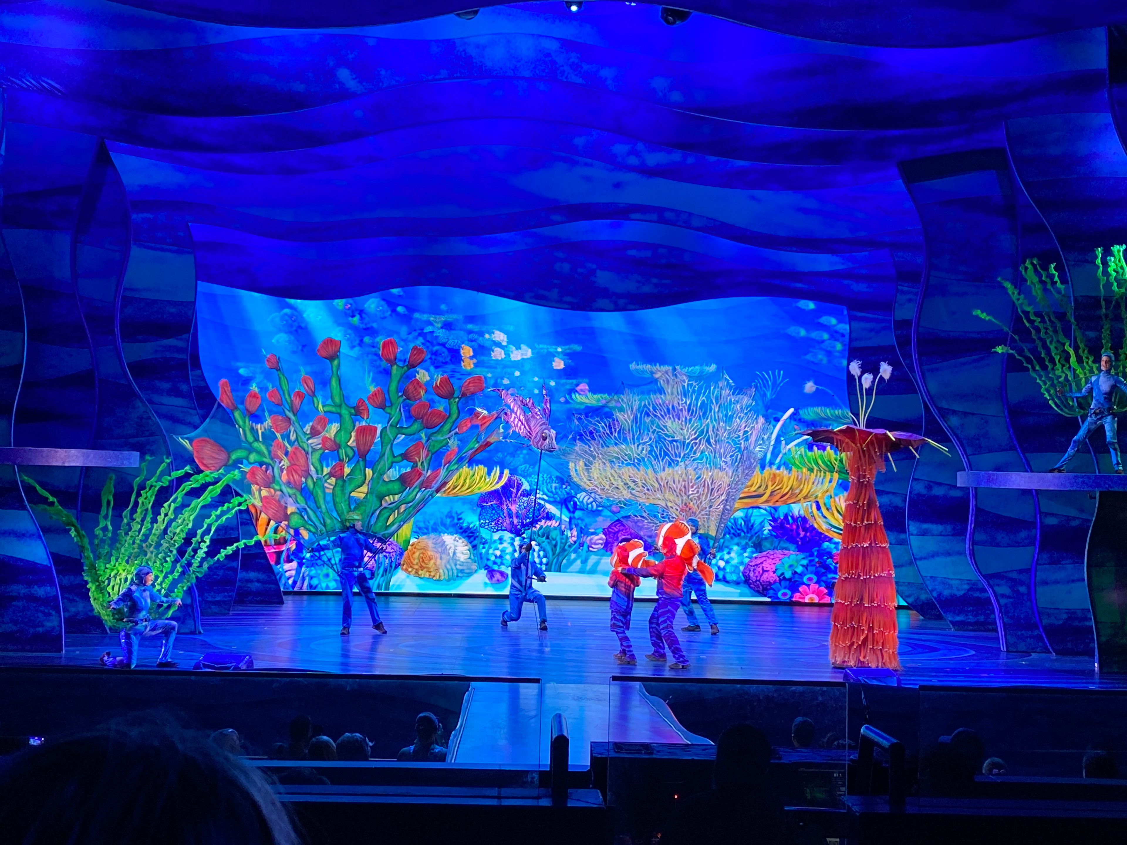 Big Blue in show with performers. Layout by Tony Reser