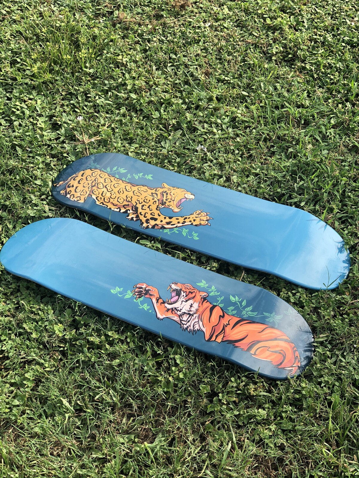 Tiger and Jaguar vinyl wrapped skateboards