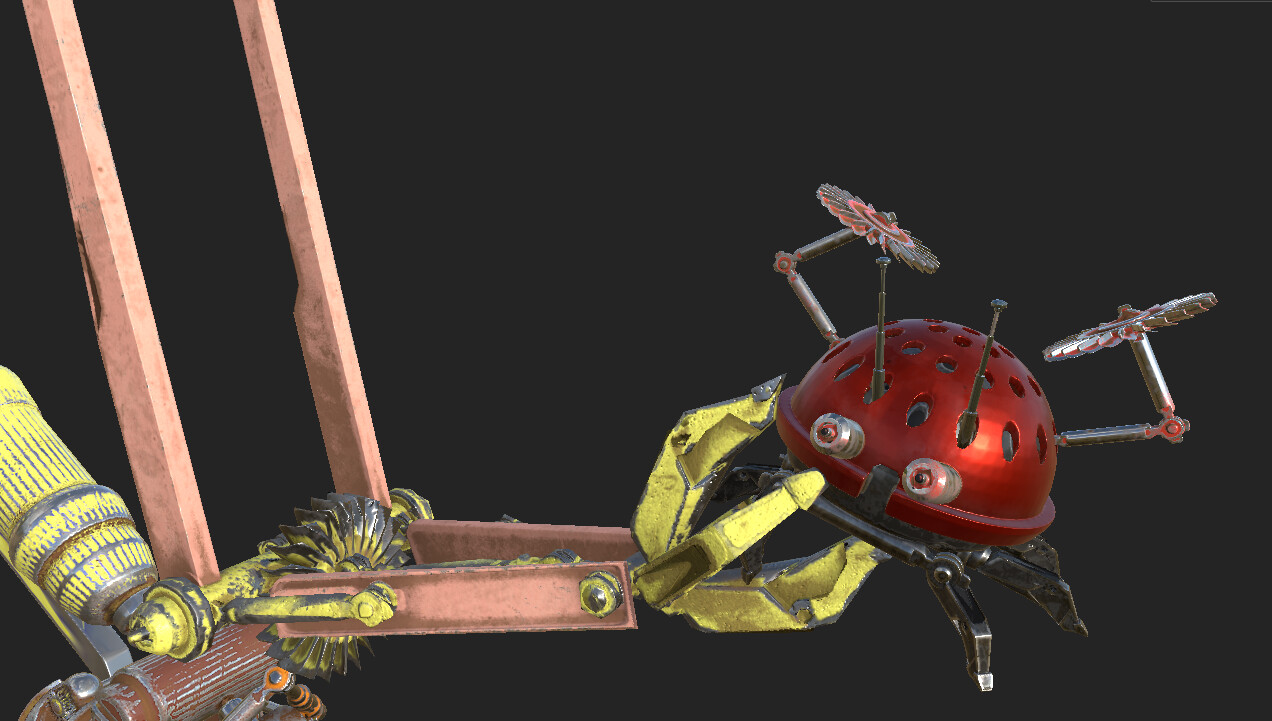 Closeup of droid holding Ladybug droid.