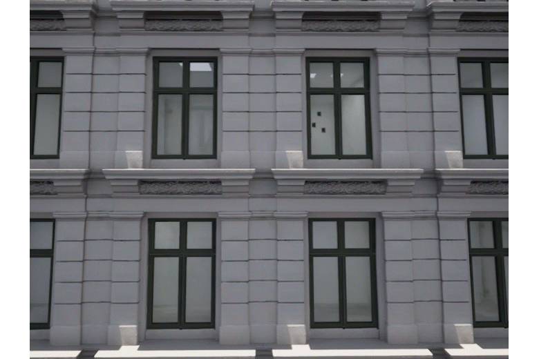 An interior mapping material has been added to a plane behind the walls to spice up the look of the building, which uses raycasting and a cubemap to create false interiors.