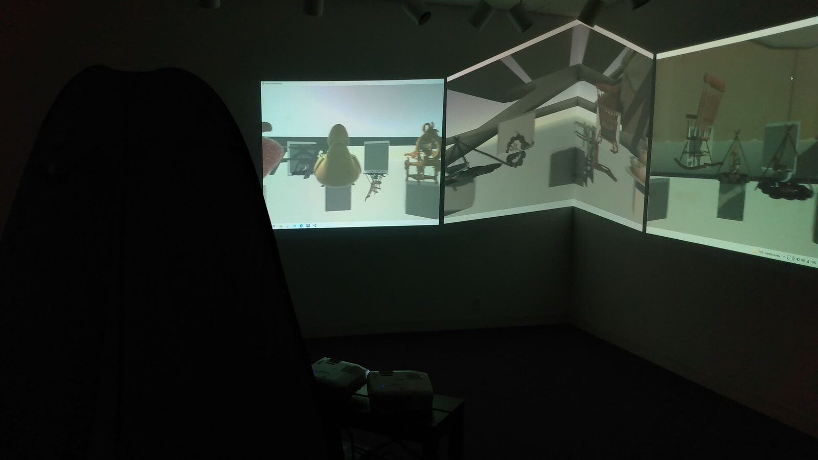 A version of the project where the scene with spawned objects is projected alto the walls, and users can either use a provided mobile device or their own device to add items to the scene.
