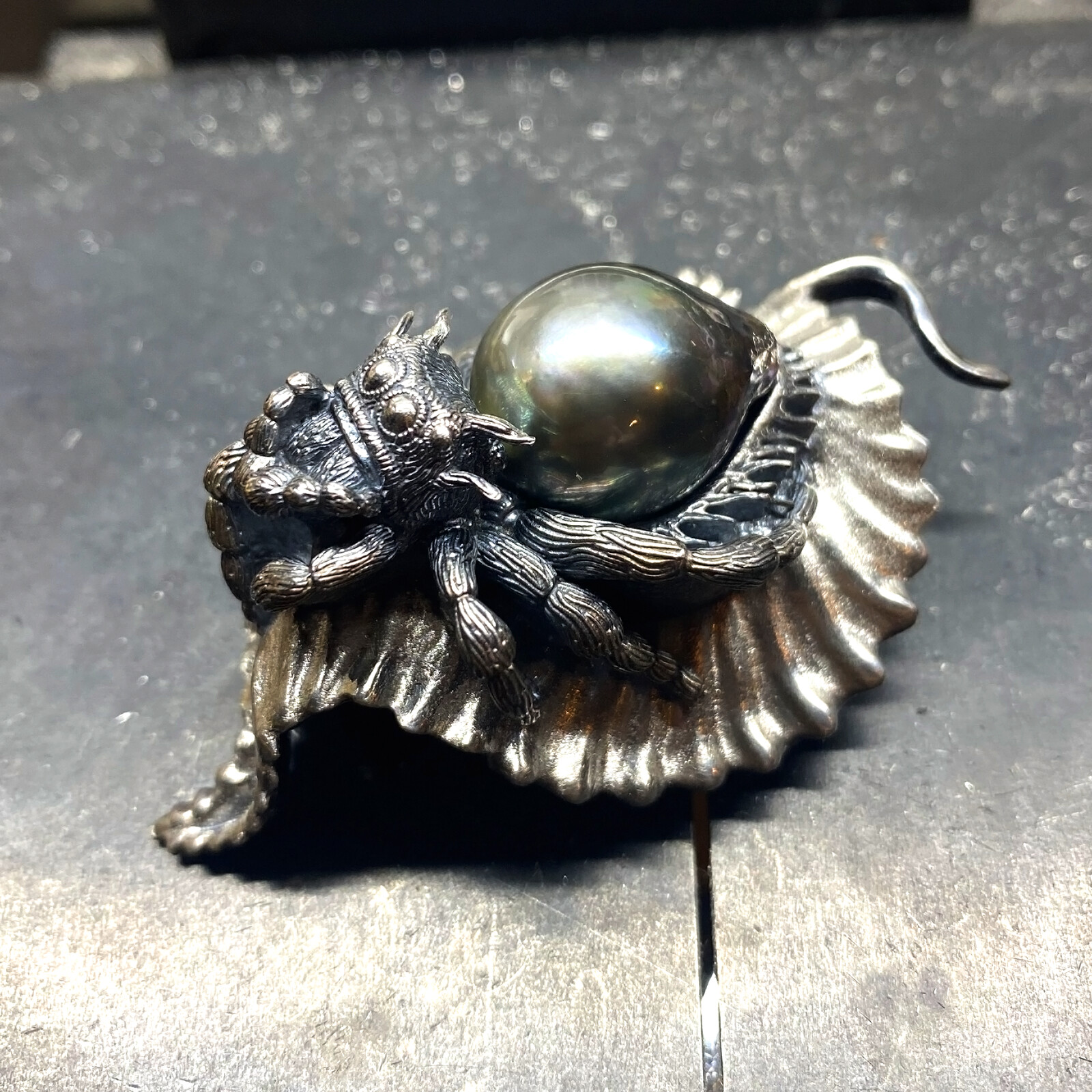 Photo of the pendant cast in sterling silver with a Tahitian pearl for the abdomen.