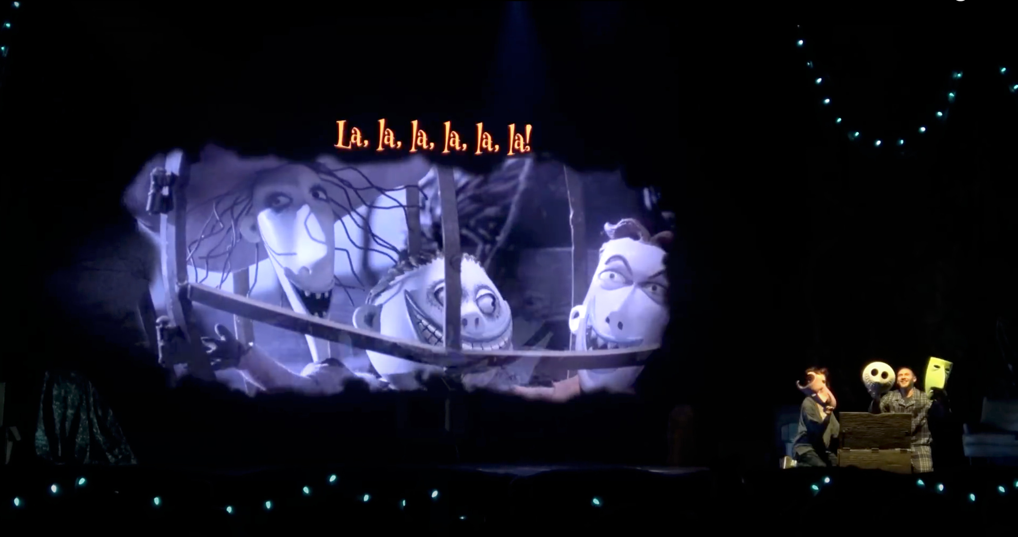 An example of one of the sing-along portions with the words at the top for the audience to see from all angles of the theatre