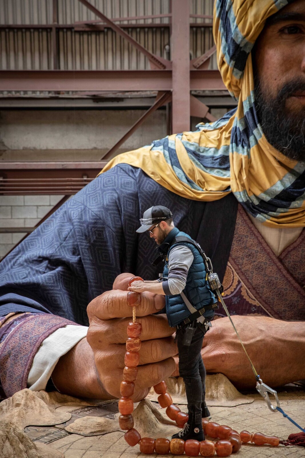 The figures created for the Dubai 2020 Expo took thousands of hours to make. Pictured here is Luke Hawker ensuring everything is placed and secured precisely as intended.