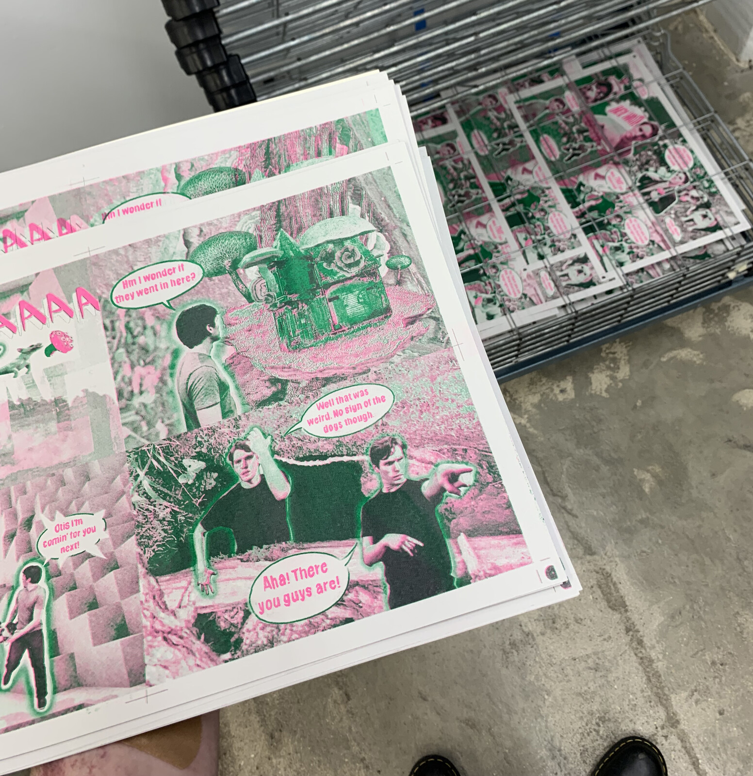 Photos showing the pages printed in Green and Pink Riso ink before being cut and bound.