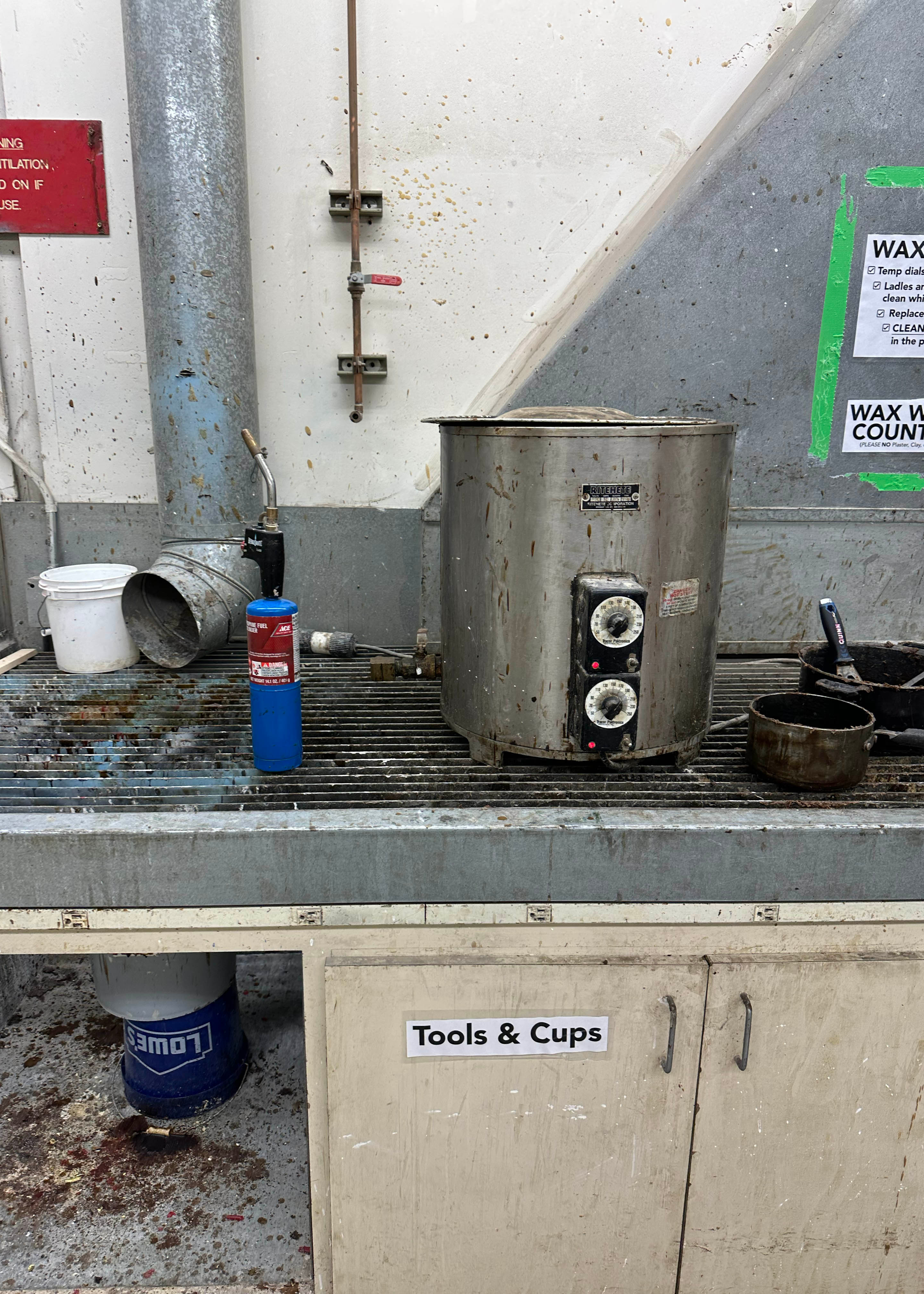 Here is our class's wax pot and pouring station