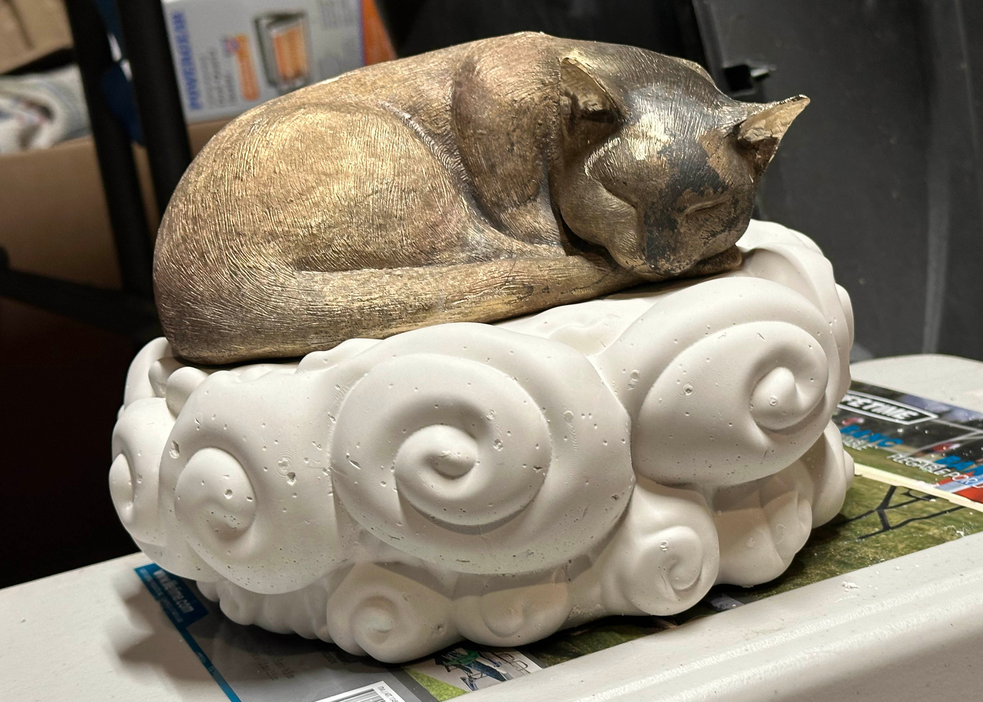 The cat fits pretty well, as you can see here I cleaned up the ears and cut off the extra bronze from the gates and vents.