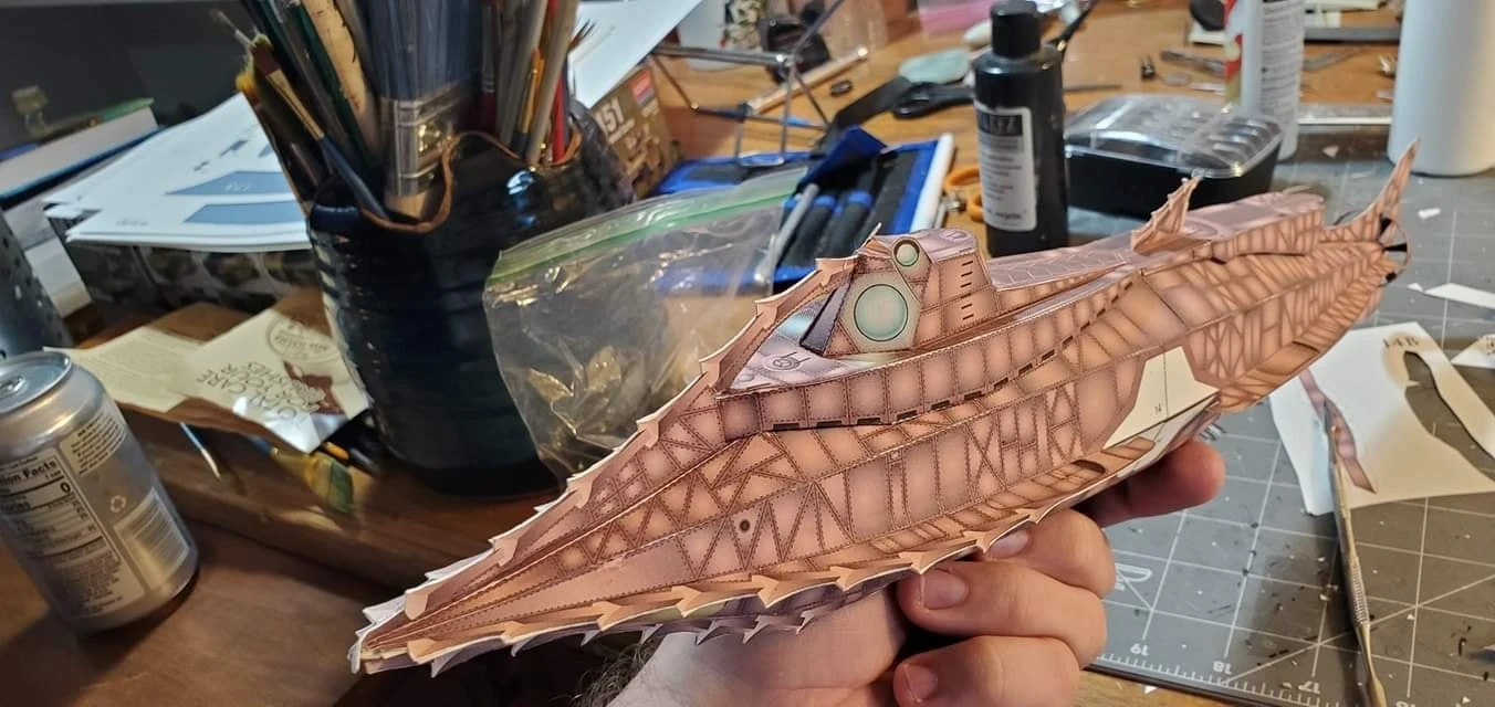 20,0000 Leagues Under the Sea - Nautilus Paper Card Model. Build by Dale Jackson. Designed by Kevin Kittle. Free Model at: https://www.disneyexperience.com/activities/models/20klus_model.php?