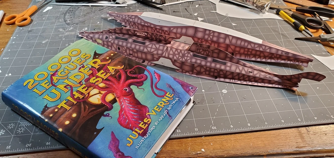 20,0000 Leagues Under the Sea - Nautilus Paper Card Model. Build by Dale Jackson. Designed by Kevin Kittle. Free Model at: https://www.disneyexperience.com/activities/models/20klus_model.php?