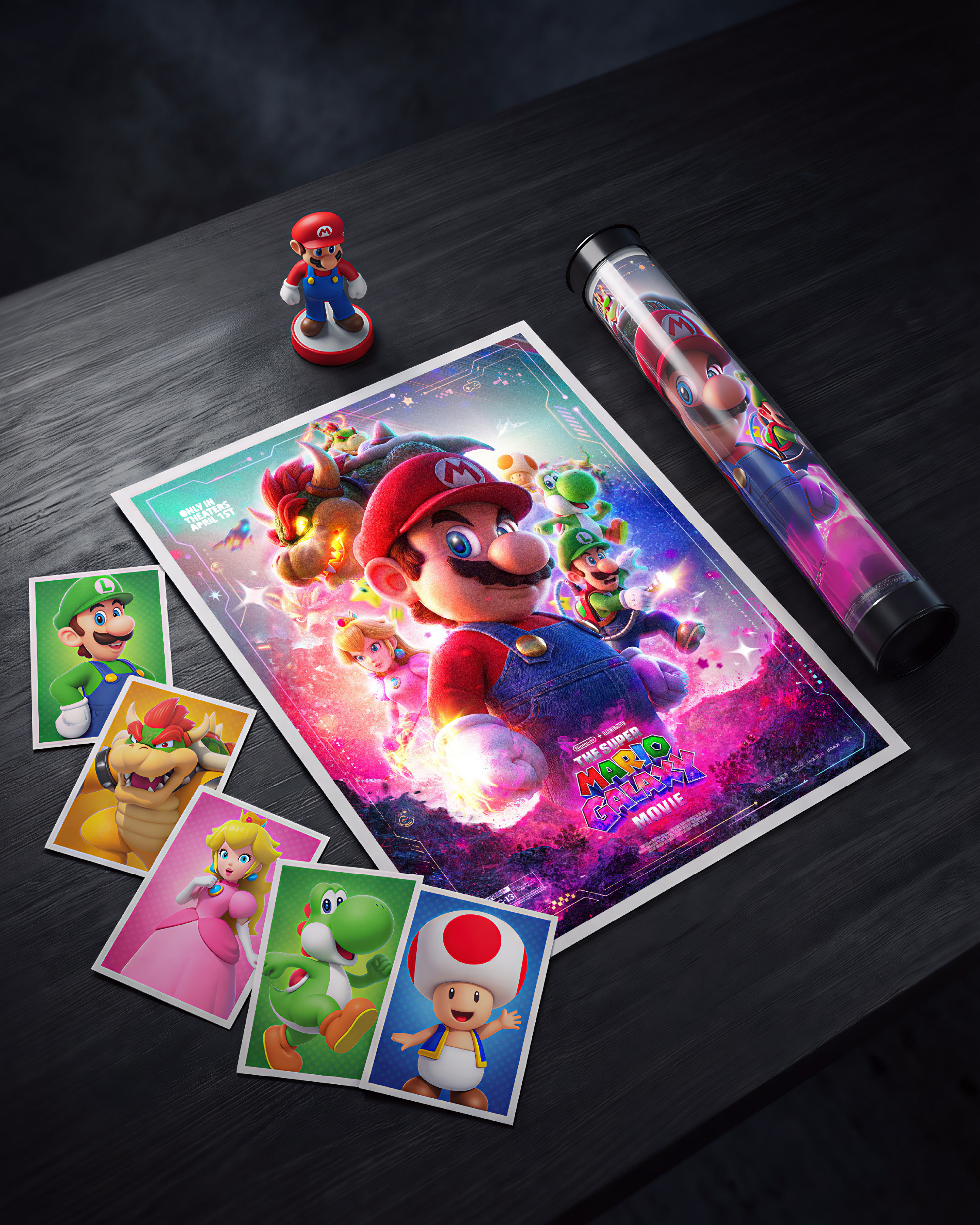 The full product ecosystem. Poster, character trading cards, amiibo, poster tube. One piece of key art extending into an entire Nintendo merchandise package