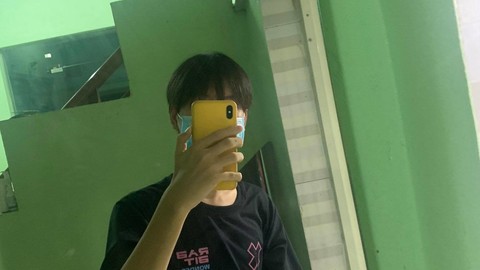 black boy shirt and phone