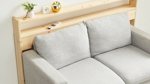 Living room side table in the gap behind the wooden sofa